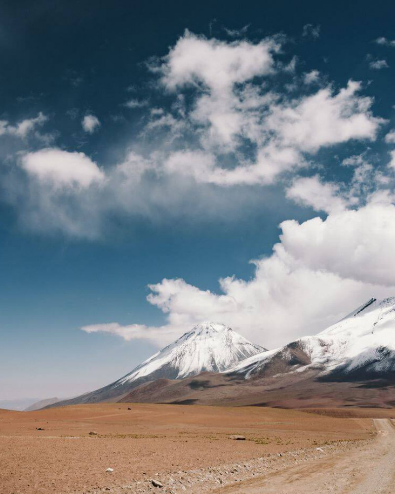 Dry landscape with a snowy mountain in the background