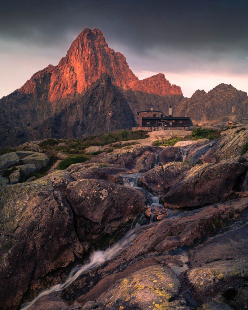 A creek and mountain in the dusk